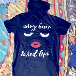 Women black eyelashes & lips top with a hoodie.